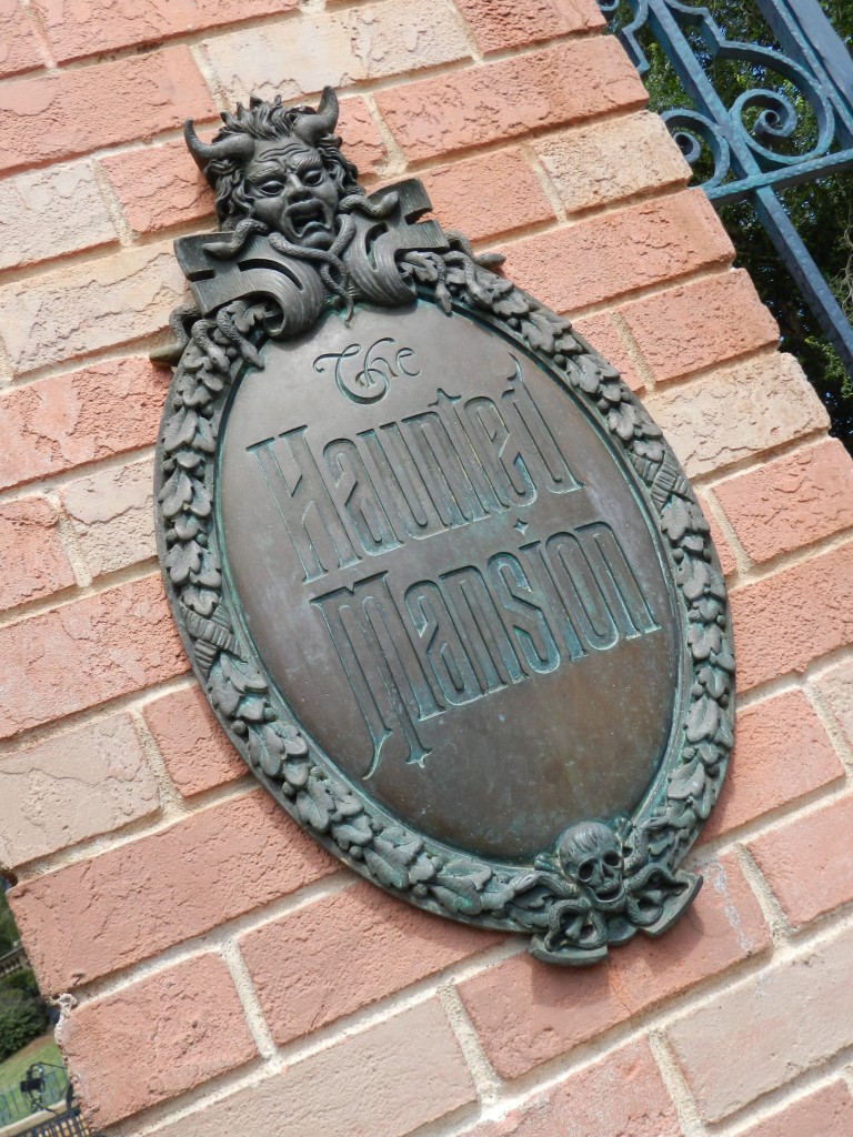 Haunted Mansion at Magic Kingdom with gargoyle statue. Disney Secrets.