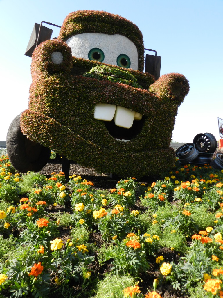 2013 EPCOT Flower Garden Festival Mater from the Cars movie topiary. Photo Copyright ThemeParkHipster.