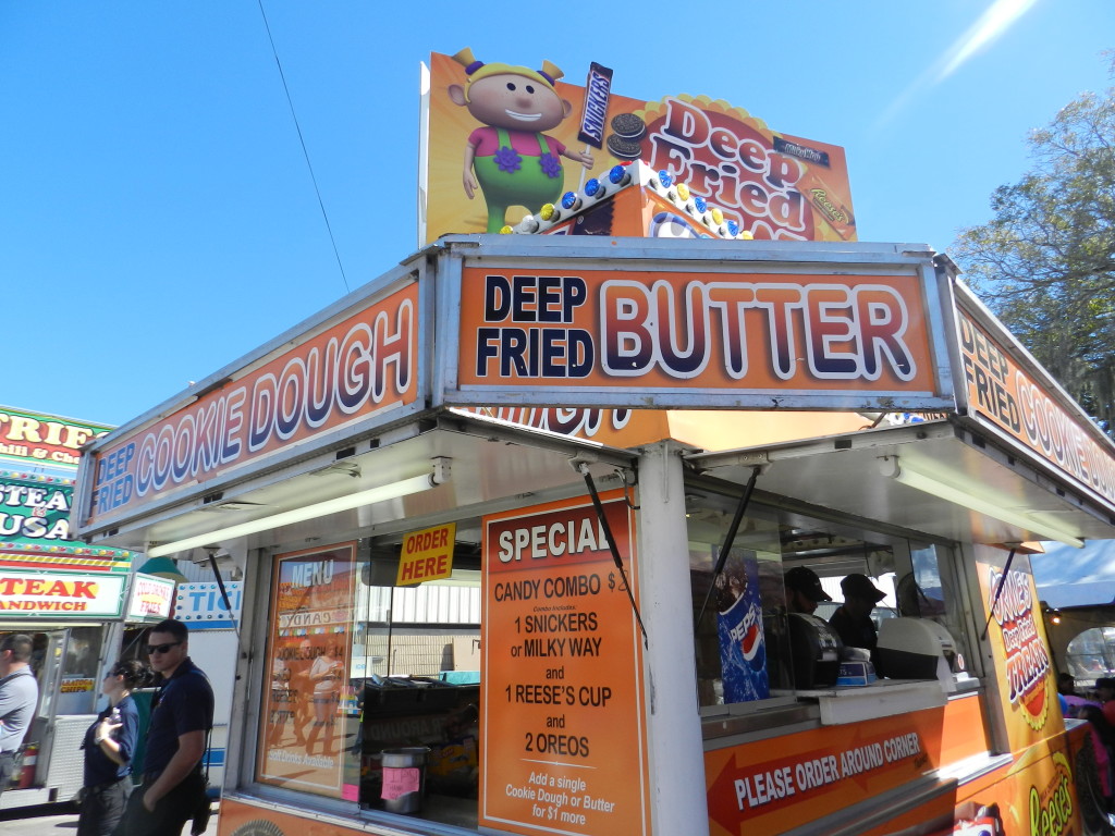 Deep Fried Butter Kiosk at the 2024 Tampa Florida State Fair. Keep reading to get the full Florida State Fair Guide with Tickets, Food, Concerts, Rides and More! Copyright ThemeParkHipster.