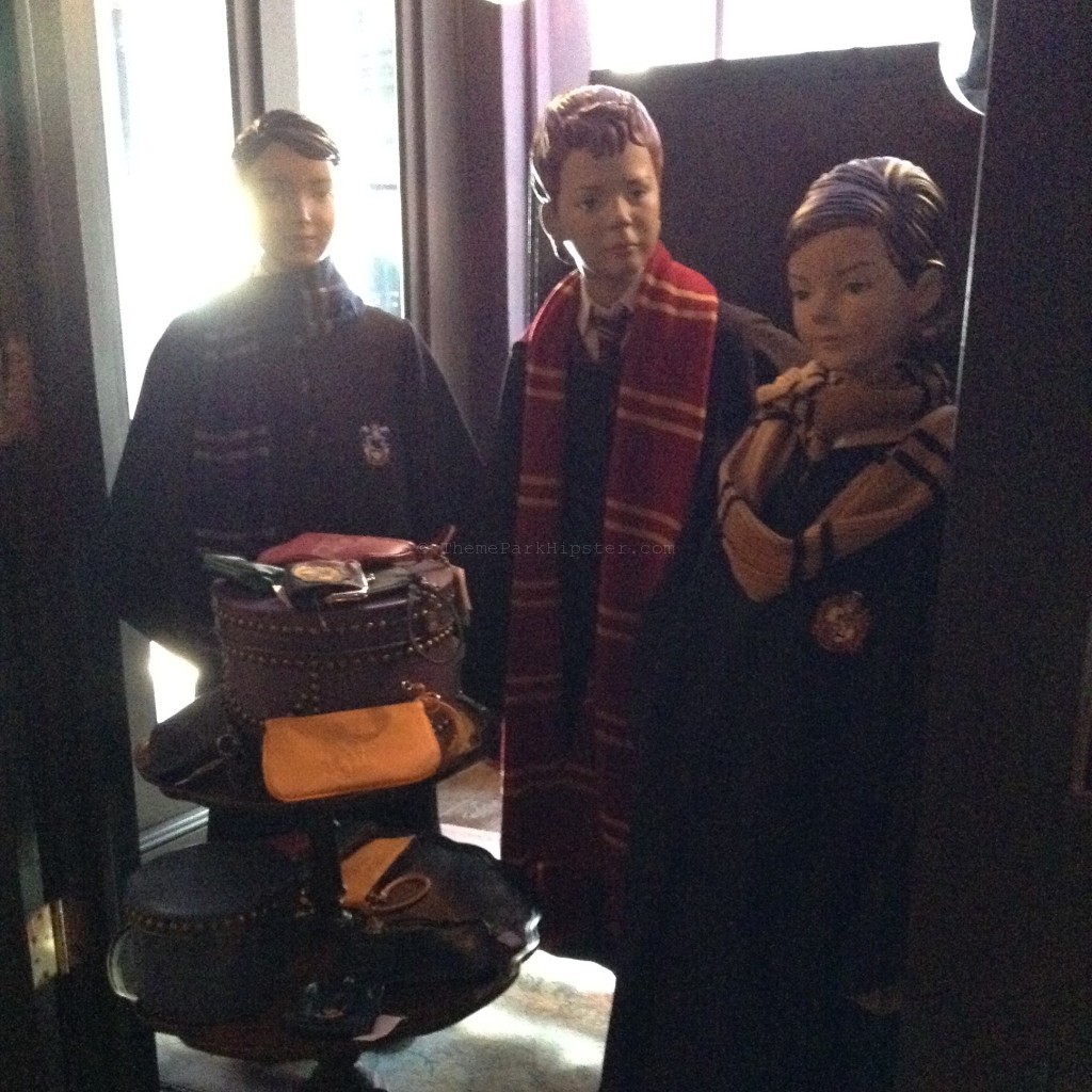 Madam Malkin’s store in Diagon Alley with Hogwarts students in robs at The Wizarding World of Harry Potter in Universal Studios.
