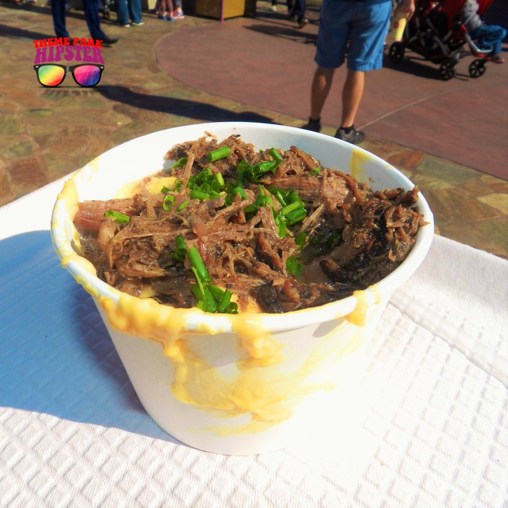 Pot Roast Mac and Cheese at the Friar's Nook in Disney World Magic Kingdom with juicy brown beef, green scallions on cream macaroni and cheese.