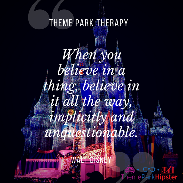 Walt Disney best quote. When you believe in a thing, believe in it all the way, implicitly and unquestionable. With Cinderella Castle covered in bright Christmas lights.