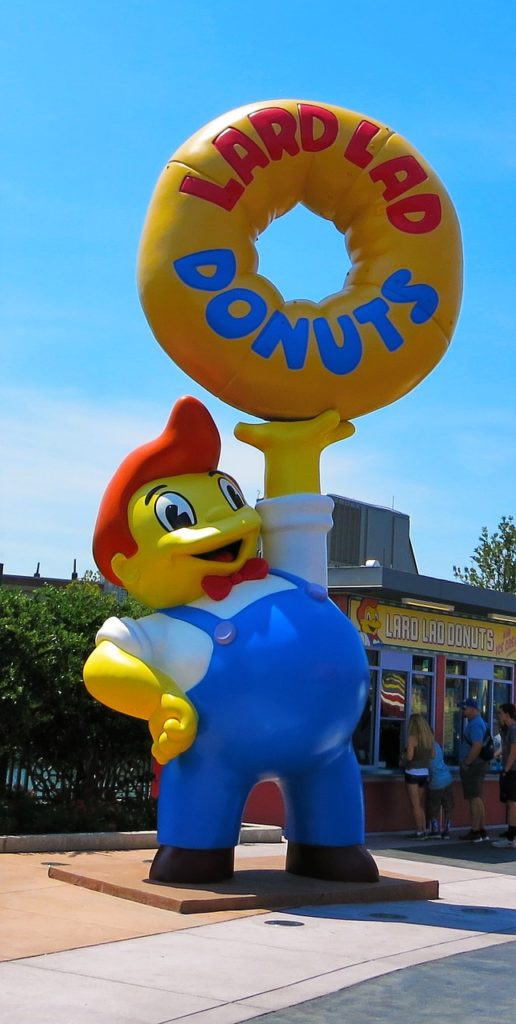 Giant Simpsons Lard Donuts Boy at Universal Studios in front of Cletus' Chicken Shack