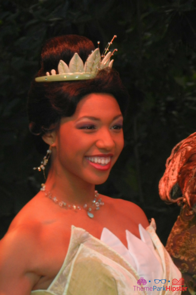Princess Tiana in a beautiful gown at the Magic Kingdom. Keep reading to learn how to have the best Disney solo trip to the Magic Kingdom.