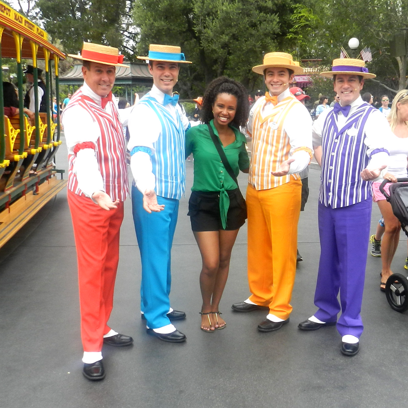 Disneyland Solo with Dapper Dans in red, blue, yellow and purple along with NikkyJ. Keep reading for your own Disneyland Itinerary!
