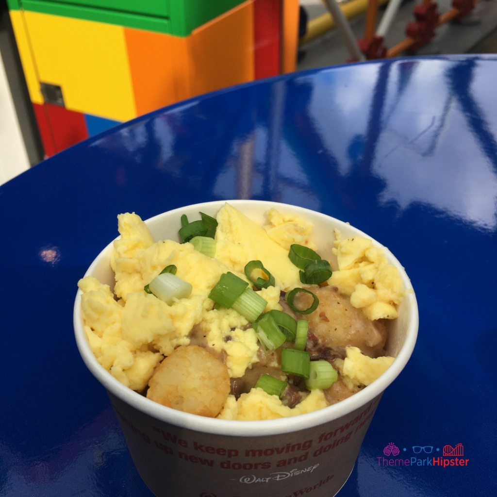 Toy Story Land food Breakfast Bowl Hearty portion of Potato Barrels smothered in Smoked Brisket Country Gravy, Scrambled Eggs and a sprinkling of Green Onions