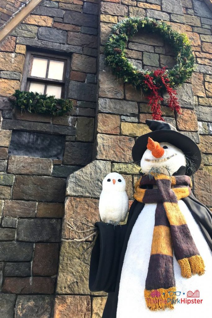Christmas at Universal Harry Potter Christmas Snowman in front of castle