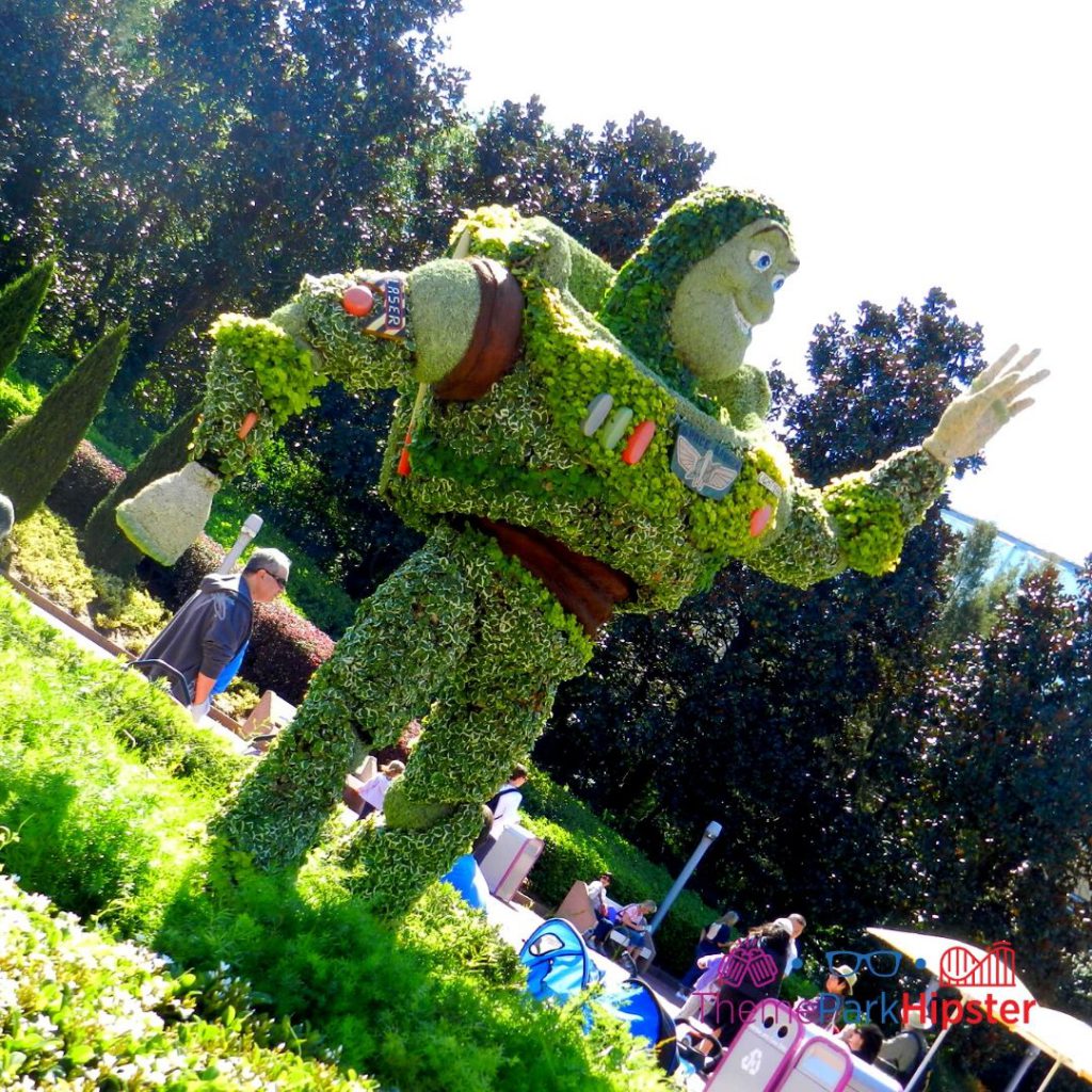 Epcot Flower and Garden Festival Buzz Lightyear Topiary. Keep reading to learn how to go to Epcot Flower and Garden Festival alone and how to have the perfect solo Disney World trip.