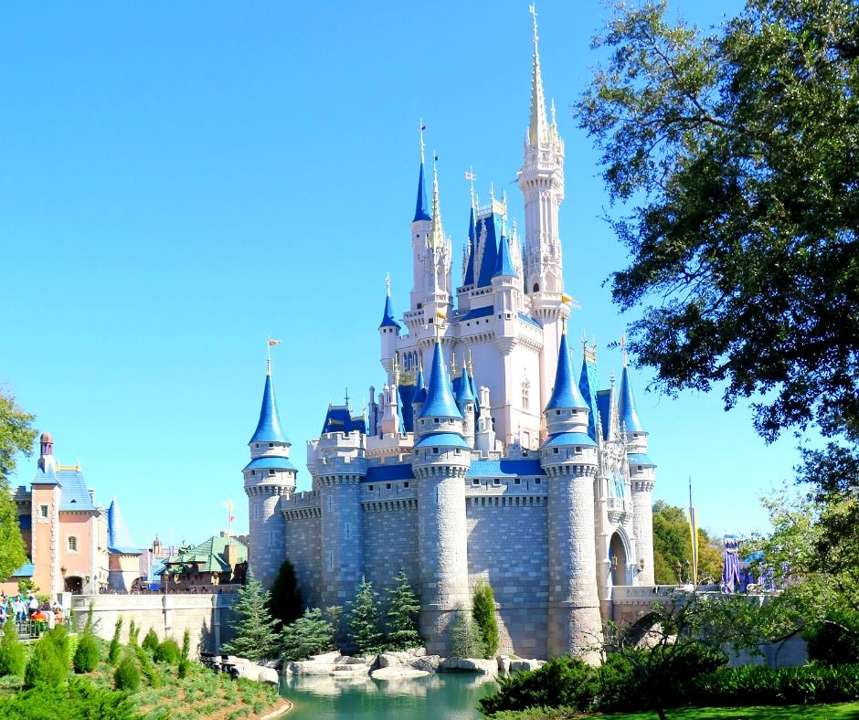 Walt Disney World for Adults with Cinderella Castle in the Florida Sun. Magic Kingdom is a beautiful and one of the best Disney world park for adults.