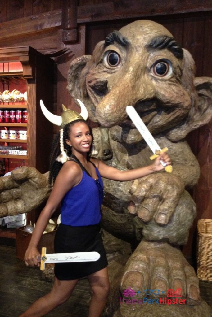 Theme Park Expert, NikkyJ, at Norway in front of troll at Epcot.