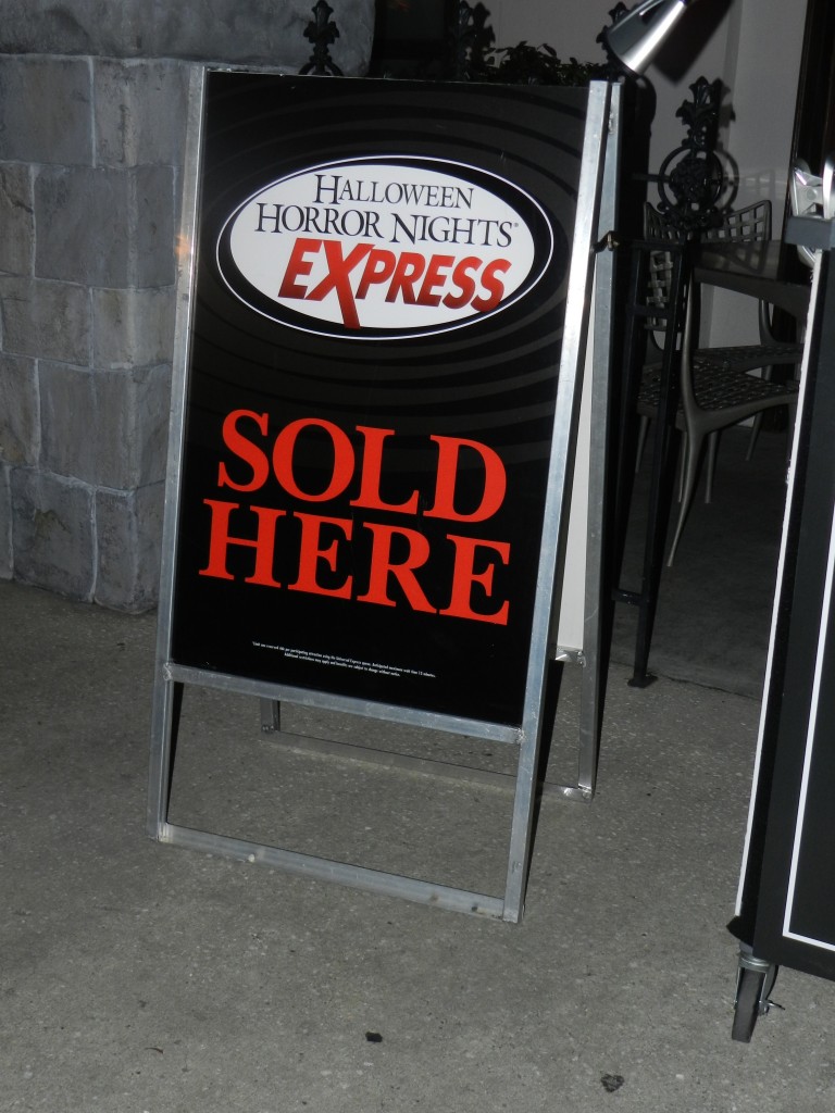 Halloween Horror Nights Express Pass HHN black, red, and white sign. Keep reading to find out if the Halloween Horror Nights Express Pass is worth it. 