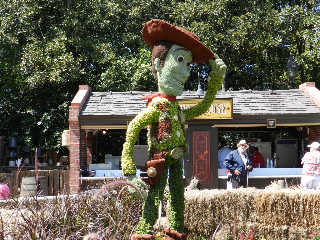 EPCOT Flower Garden Festival 2013 Woody from Toy Story Topiary. Keep reading to see the best epcot flower and garden topiaries through the years!