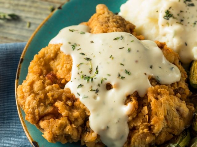 Fried Chicken covered in white gravy Olivias Cafe Thanksgiving at Disney