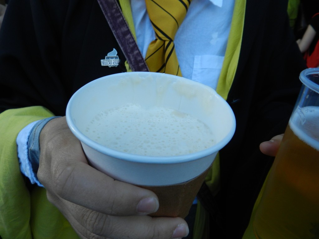Warm, creamy butterbeer with white foamy top is a winner that you must try inside the wizarding world of harry potter celebration.