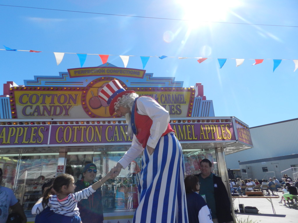 Uncle Sam on Stilts Greeting Kids. Keep reading to get the full 2025 Florida State Fair Guide with Tickets, Food, Concerts, Rides and More! Copyright ThemeParkHipster.