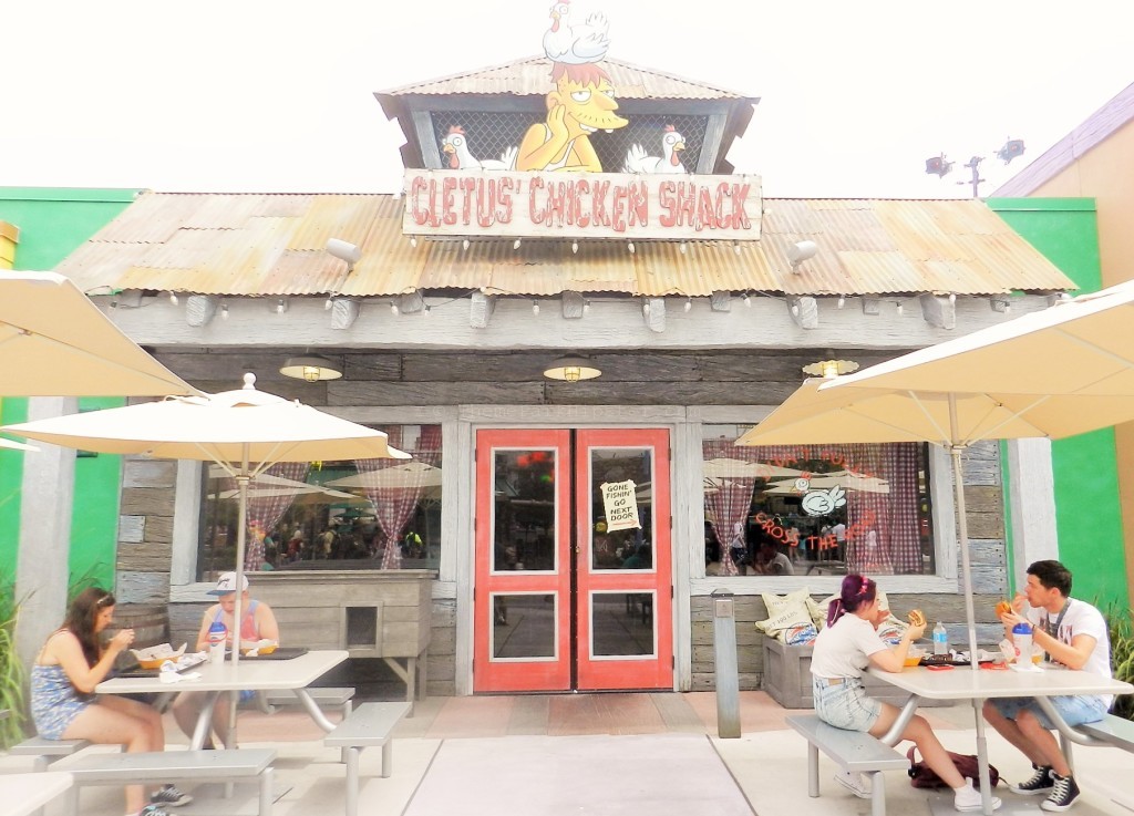 Cletus' Chicken Shack entrance with people eating: Universal Studios Orlando