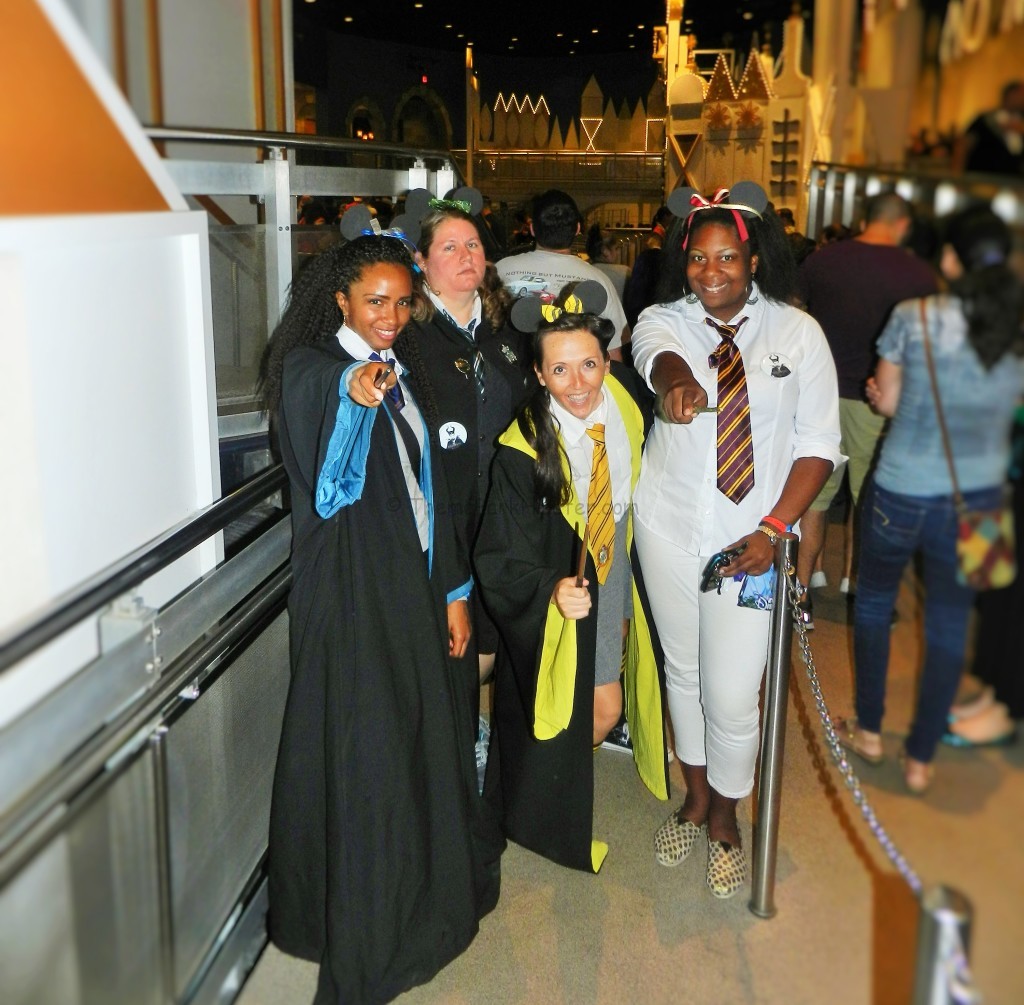 Wizards in Hogwarts robes on it's a small world at Disney's Magic Kingdom.