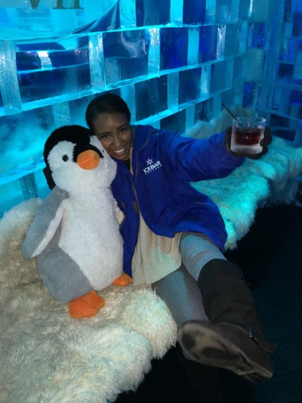 Woman visiting Icebar in Orlando using Groupon discount.