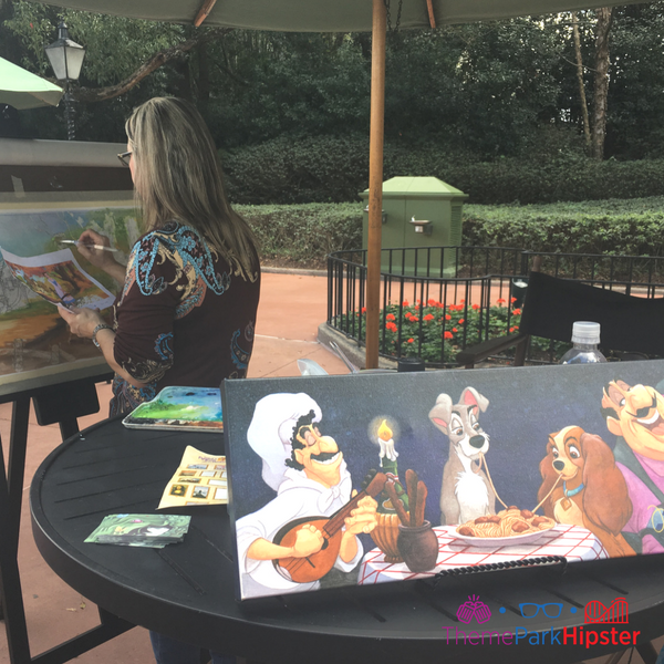 Epcot Festival of the Arts Artists Painting on the World Showcase Pathway. Keep reading to get the fun and best things to do at Epcot Festival of the Arts!