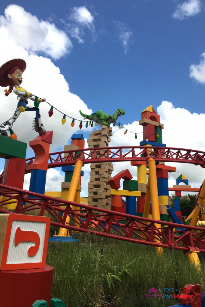 Jessie holding Christmas lights in Toy Story Land.
