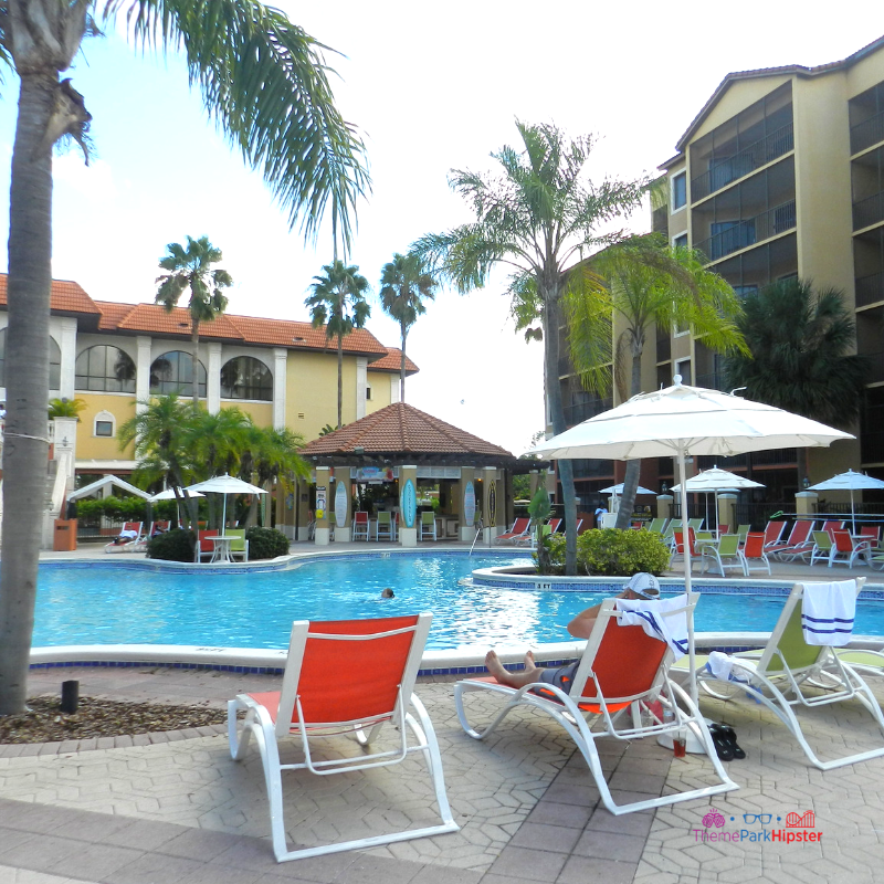 Westgate Lakes Resort Villa Orlando pool area with colorful lounge chairs.