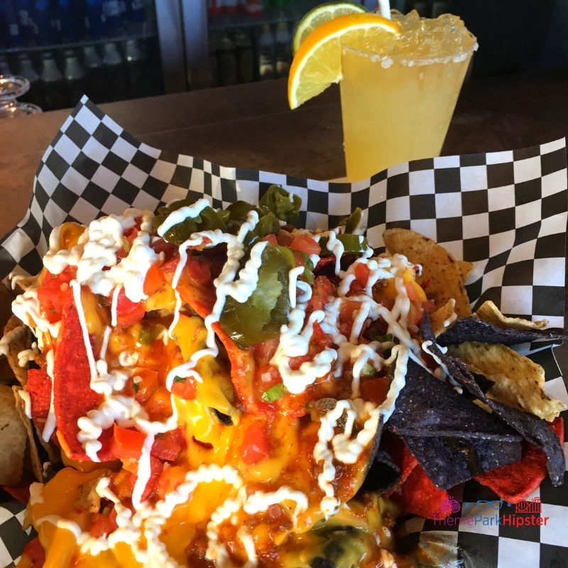 SeaWorld Orlando Food and Drinks Margarita and Nachos at Flame Craft Bar. Keep reading to learn how to have a Solo Trip to SeaWorld and how to travel alone with anxiety.