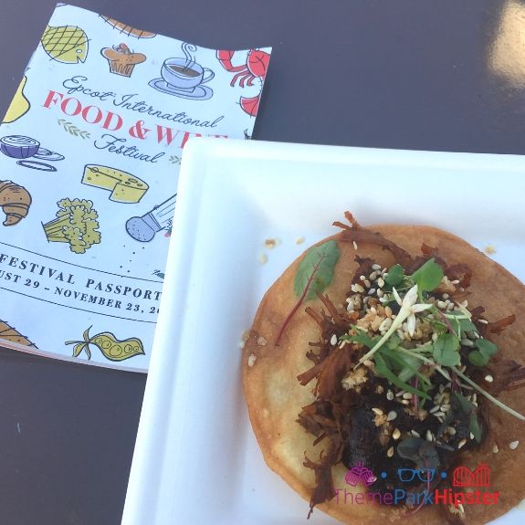 Mexico shredded beef on tortilla at Epcot Food and Wine Festival. Keep reading to learn about the best food at Epcot Food and Wine Festival!