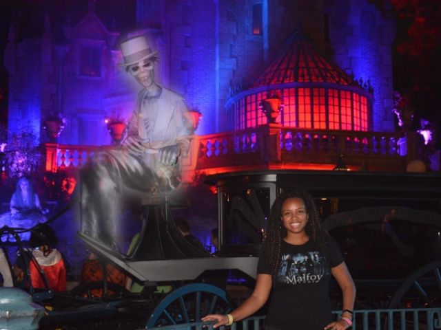 NikkyJ at Mickeys Halloween Party Ghost PhotoPass in front of the Haunted Mansion. Keep reading to get the guide to Mickey's Not So Scary Halloween Party Tips with Photos, Parade details, characters, rides and more!
