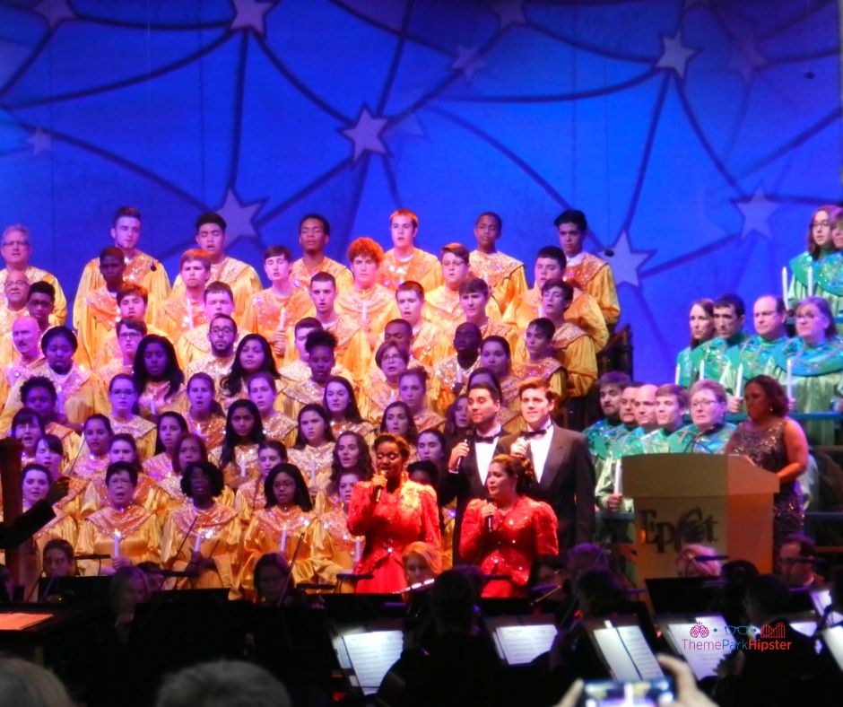 Epcot Candlelight Processional Chandra Wilson of Greys Anatomy. Disney Epcot at Christmas. Keep reading to learn about 2023 Epcot International Festival of the Holidays!