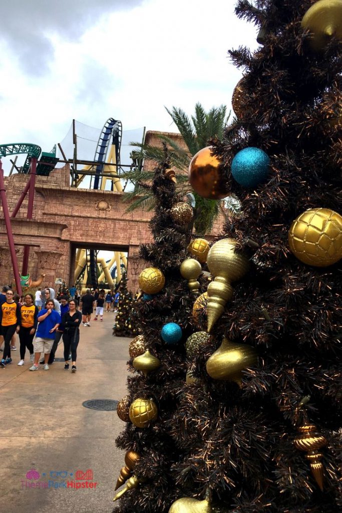 Christmas Town Decoration in Tampa with Christmas Tree near Montu roller coaster. Keep reading to get the full guide on doing Christmas at Busch Gardens Tampa!