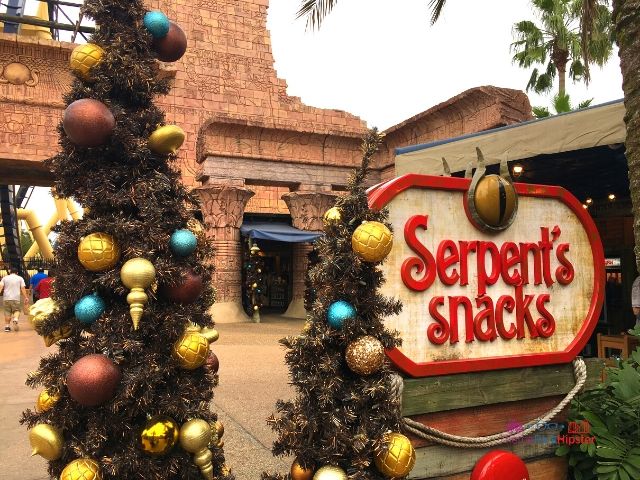Christmas Town Village at Busch Gardens Tampa Egypt Decor at Serpent's Snacks in front of Montu