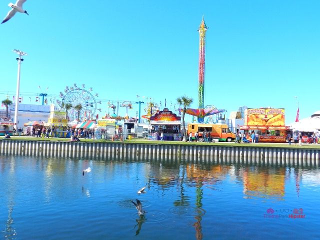 Florida State Fair Rides in front of water