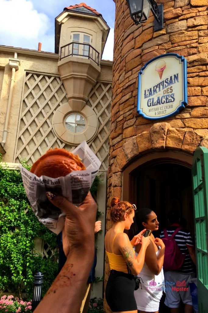 Front entrance to L'Artisan Des Glaces France Pavilion, Epcot. Keep reading to learn what are the 10 best snacks at EPCOT for all foodies. 