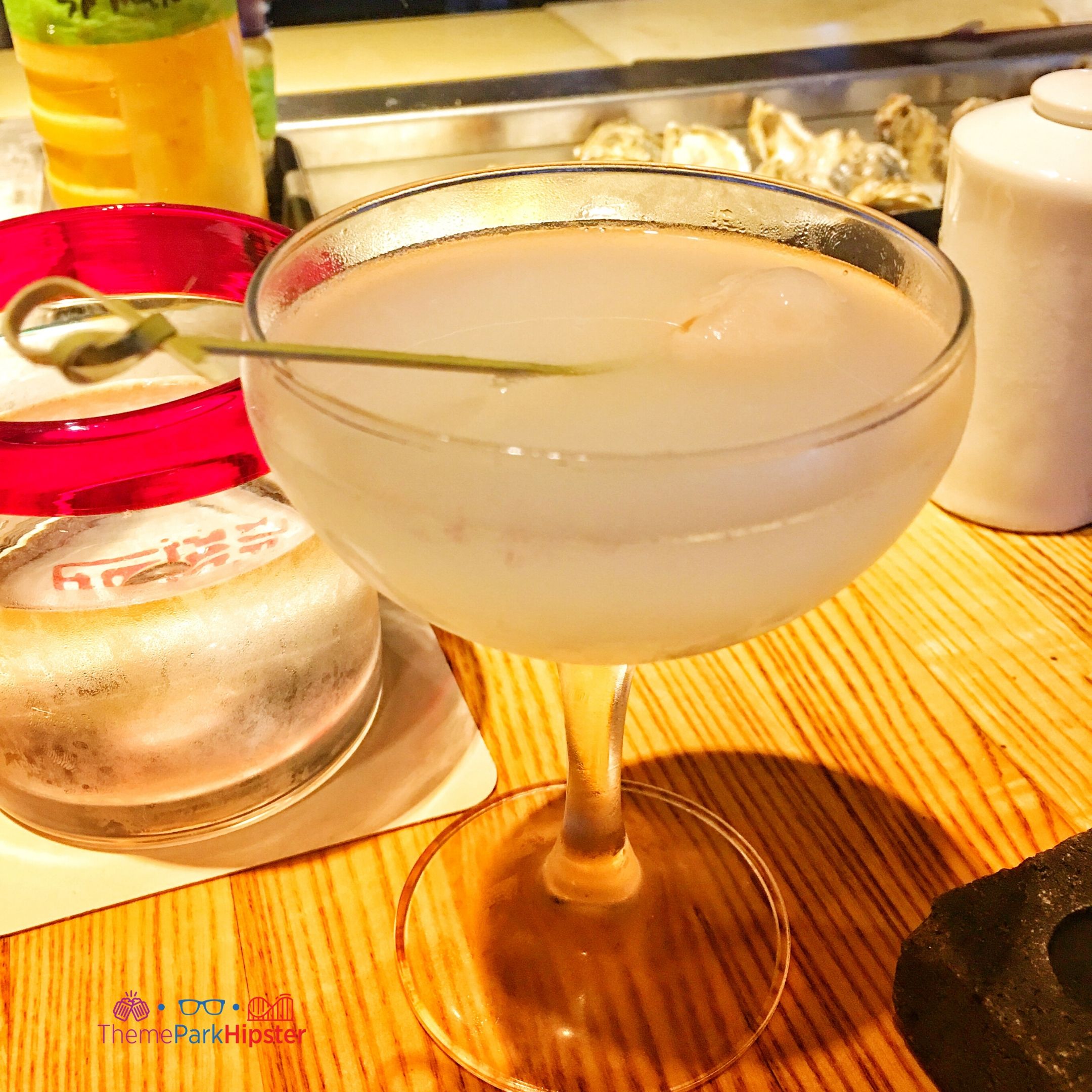 Lychee Martini in Morimoto Asia Disney Springs. Keep reading to get the best drinks at Disney Springs and the best adult beverages at Walt Disney World!