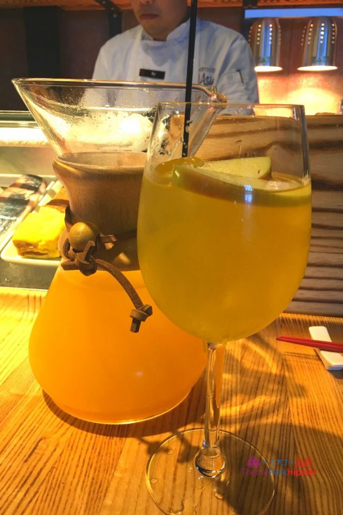 Morimoto Tropical Orange Sangria Sake in glass in Disney Springs