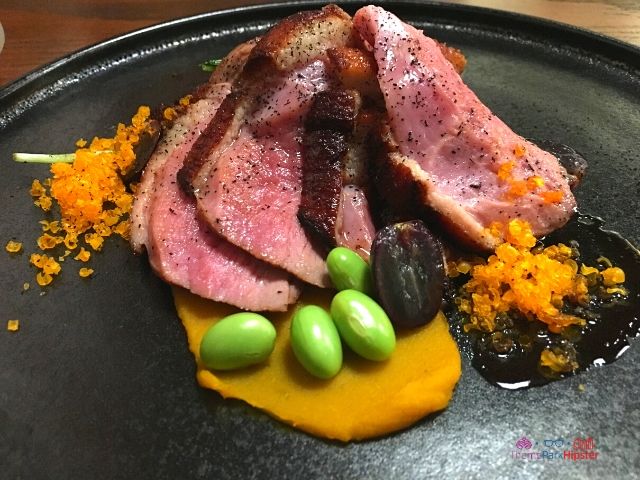 Takumi Tei Japanese Restaurant Epcot Kamo Rosu - Roasted Duck_ Marinated Duck, Kabocha Squash, Edamame Beans, Japanese Mizuna, Cured Duck Egg Yolk, Grape Reduction
