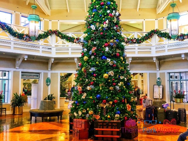 Port Orleans Riverside Resort Lobby with Christmas Tree. Keep reading to learn about the best Disney Christmas trees!