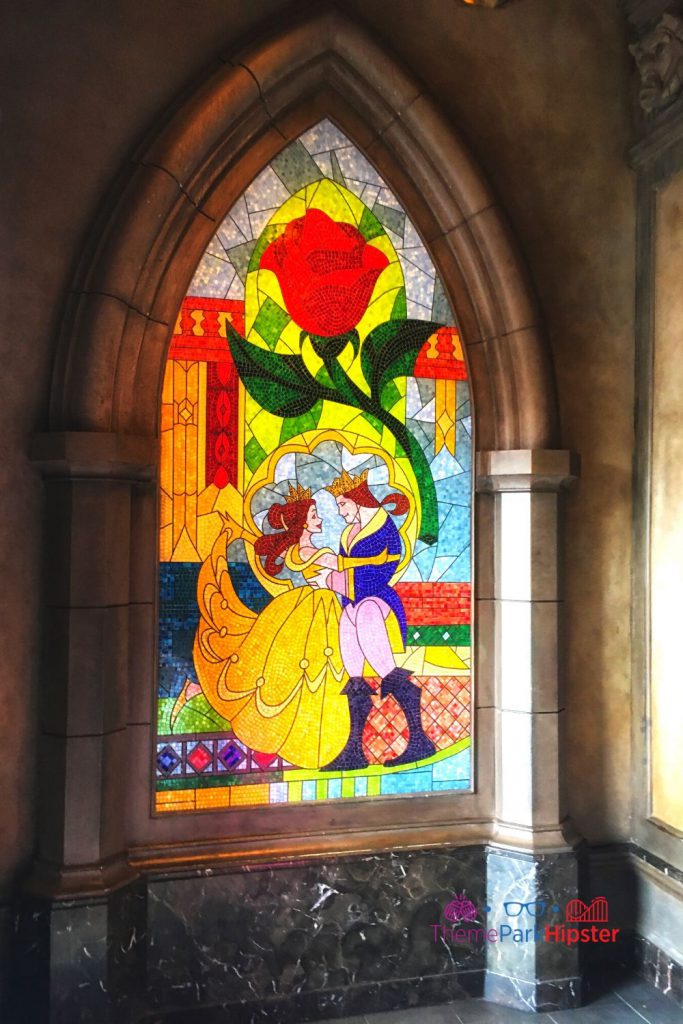 Be Our Guest Restaurant Belle and Prince Mural Window Stain. Keep reading to get the best Disney Christmas songs!