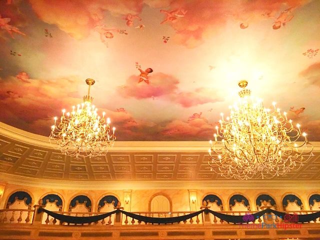 Angles painted on the ceiling of the ballroom inside Beast’s castle at Disney World.