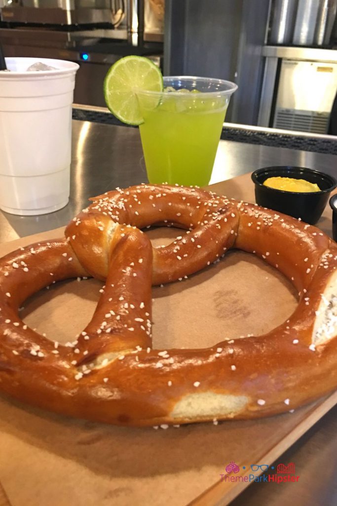 Baseline Tap House at Hollywood Studios with Pretzel and Margarita. Keep reading to learn about where to get the best drinks at Hollywood Studios.