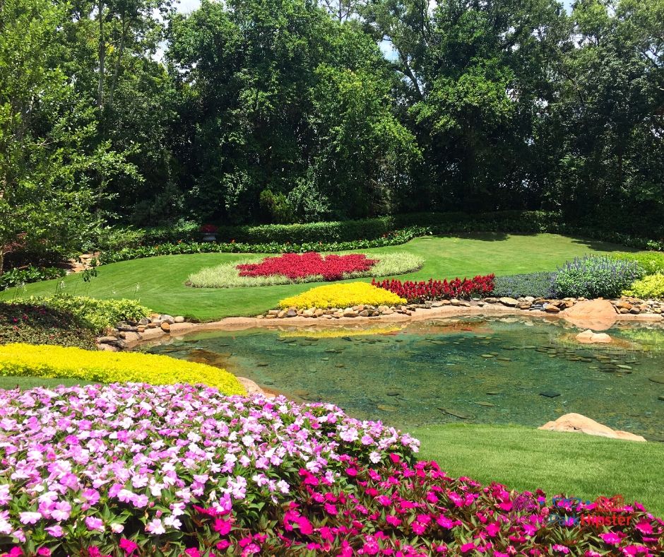 Epcot Pavilion Victoria Gardens with red and pink flowers
