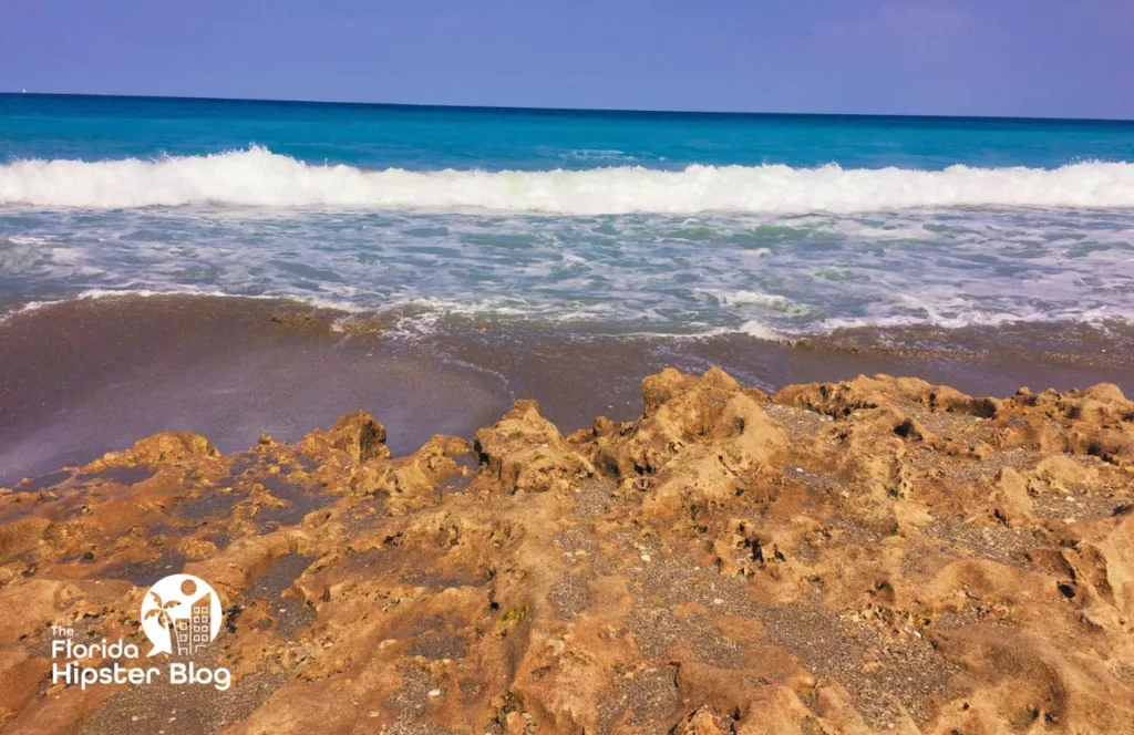 Jupiter Beach Florida Splashing Rocks. Keep reading to get the best ways to beat the summer Florida heat.