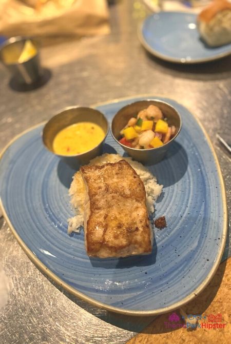 Coral Reef Restaurant at Disney Grilled Mahi with pineapple salsa. Part of the Epcot Flower and Garden Festival Rocks Concert.
