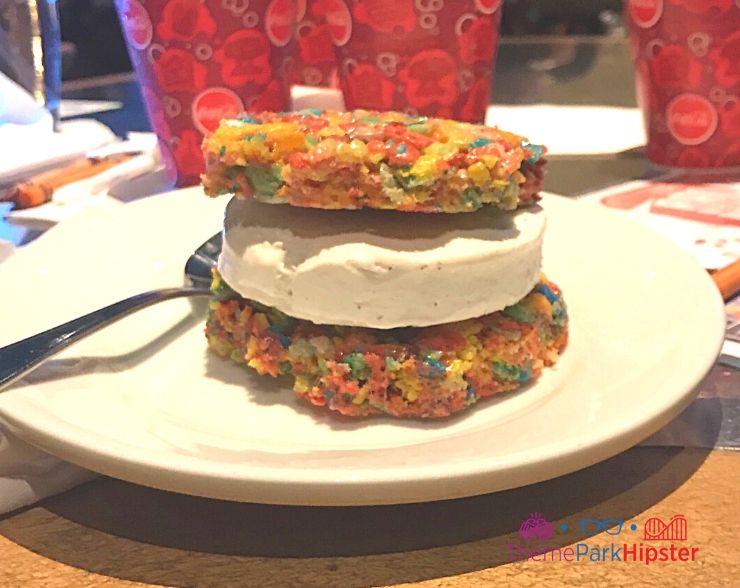 Coral Reef at Epcot Rainbow color rice crispy treat with ice cream sandwiched between 