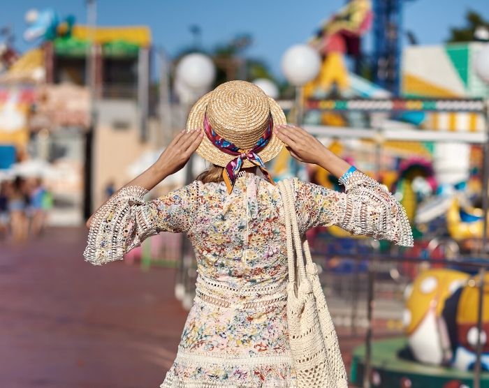 Solo Travel Tips for Theme Parks with Woman at Carnival