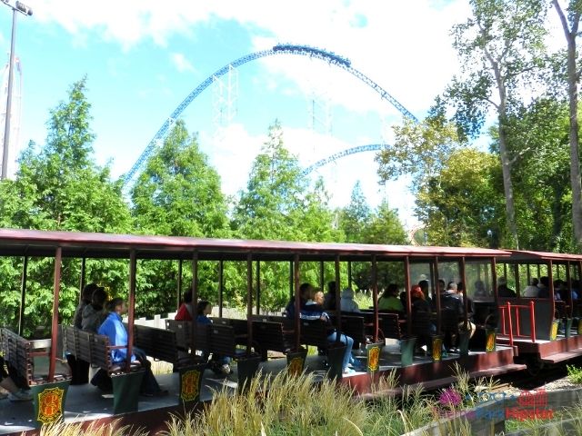 Millennium Force train going over curve with train going by at Cedar Point