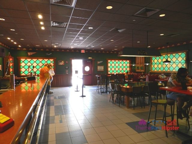 Moes Tavern Interior at Universal Studios Florida with Springfield inspired alcohol beverage options. Keep reading to get the best photos at Moe's Tavern Universal Studios and the menu.