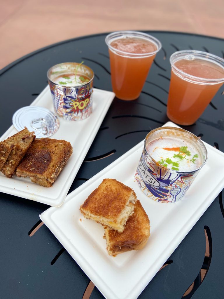 Tomato Soup and Grilled Cheese with Glitter Beer at Epcot Festival of the Arts. Keep reading to get the full Epcot Festival of the Arts Menu!