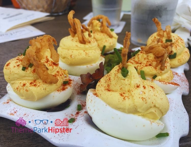Homecomin Disney Springs Deviled Eggs. Keep reading to learn where to find the best brunch and breakfast in Disney Springs.