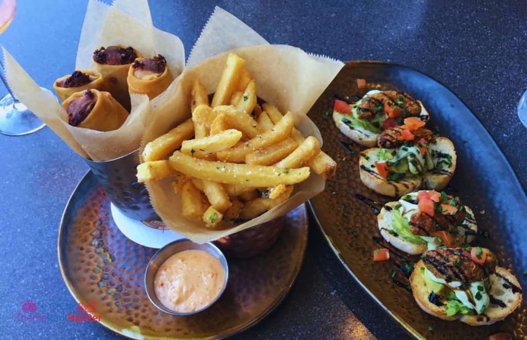 Toothsome Chocolate Emporium Avocado Toast and Fries. Keep reading to get the full Guide to Universal CityWalk Orlando with photos, restaurants, parking and more!